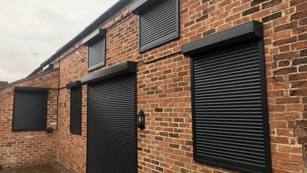 Heavy-duty shop roller shutter closed for security and weather protection UK