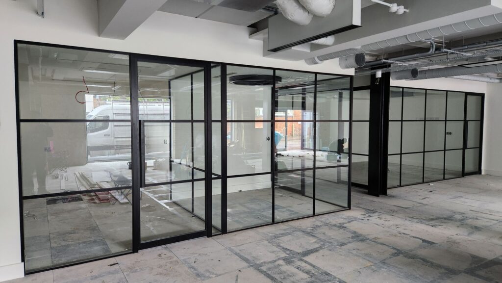Frameless glass partition installation for modern offices in Scotland